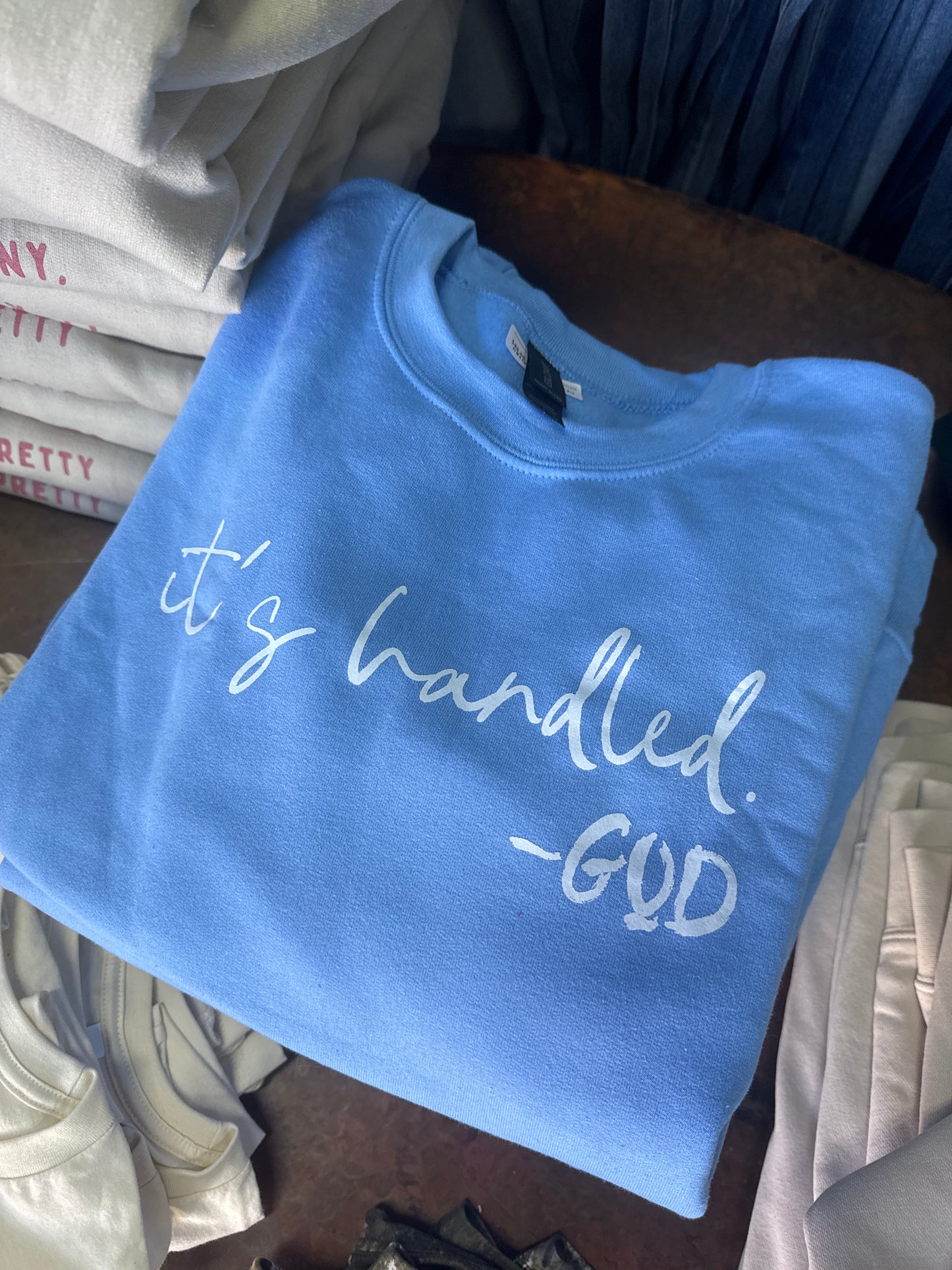 It is Handled crewneck